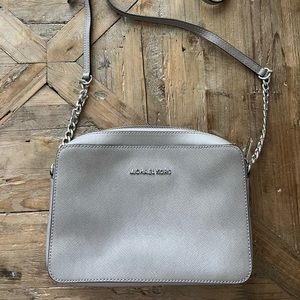 Gently used Michael Kors crossover! Sturdy leather with silver details!